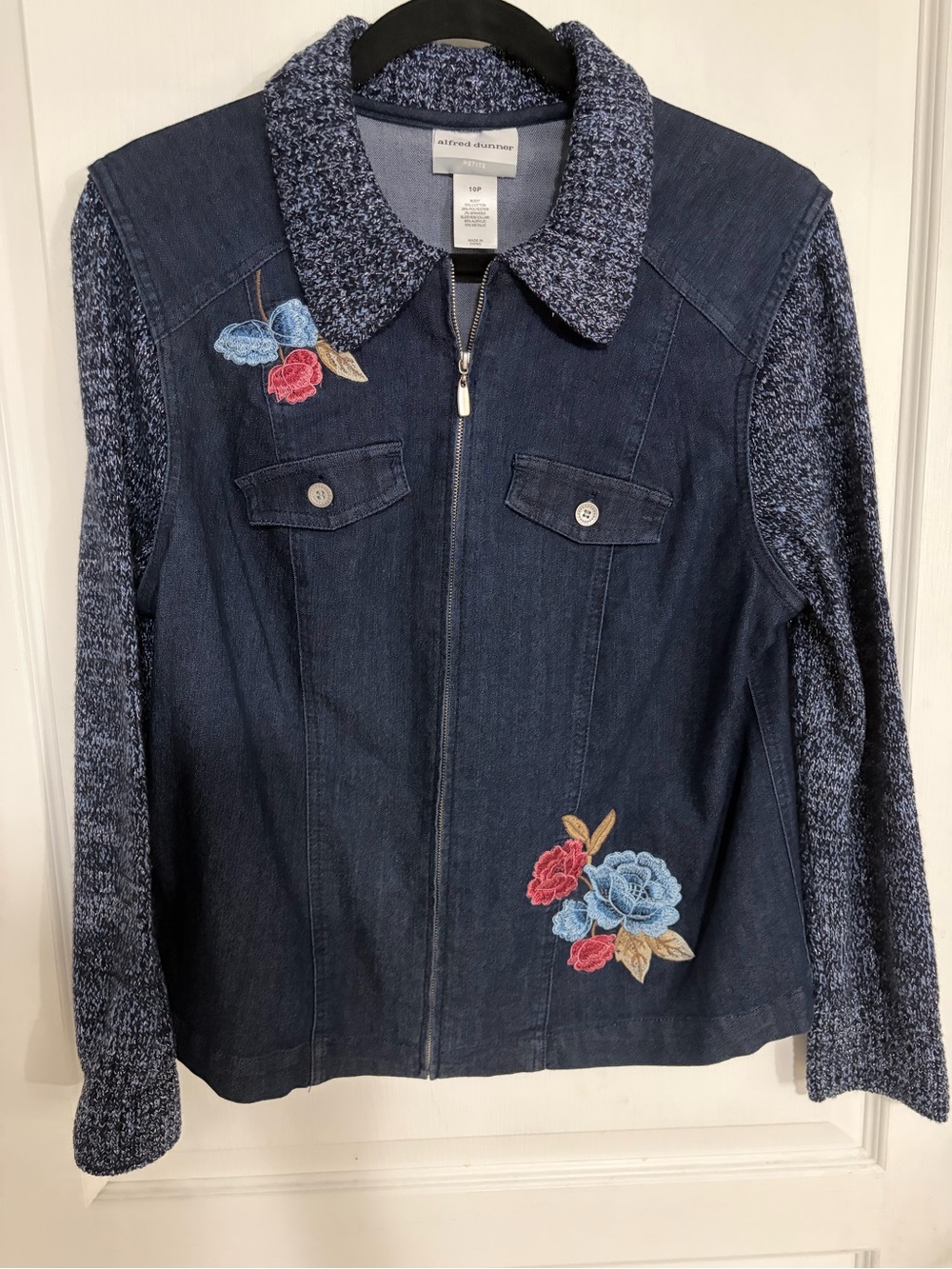 Alfred Dunner denim jacket featuring floral embroidery and knit sleeves